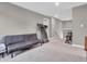 Finished basement area perfect for workout with carpet, couch, and bright recessed lighting at 3053 Creekridge Ct, Columbus, IN 47201