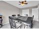 Cozy dining room with a ceiling fan and a table covered with a black tablecloth at 3053 Creekridge Ct, Columbus, IN 47201