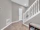 Inviting entryway with hardwood floors, a staircase, and neutral walls at 3053 Creekridge Ct, Columbus, IN 47201