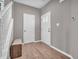 Entryway with light hardwood flooring, white trim, and a neutral color palette at 3053 Creekridge Ct, Columbus, IN 47201