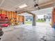 Spacious garage with an open door and organized storage that provides ample parking and workspace at 3053 Creekridge Ct, Columbus, IN 47201