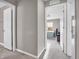 Hallway with open doors to bedrooms, with neutral-colored walls and carpeted flooring at 3053 Creekridge Ct, Columbus, IN 47201
