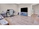 Living room has a large tv, gaming chair, hardwood floors, and comfortable seating at 3053 Creekridge Ct, Columbus, IN 47201