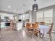 Wide angle of open concept floor plan with kitchen, dining area, and window view at 3053 Creekridge Ct, Columbus, IN 47201