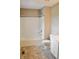 Bright bathroom with a tub/shower combination, toilet, and vanity with tile flooring at 3078 Creekridge Ct, Columbus, IN 47201