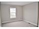 Bedroom showcasing neutral carpet, base trim, light walls and a window letting in natural light at 3078 Creekridge Ct, Columbus, IN 47201
