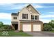 Charming two-story home features a brick facade, attached two-car garage, and well-manicured lawn at 3078 Creekridge Ct, Columbus, IN 47201