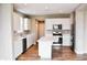 Spacious kitchen featuring a central island with white cabinets and stainless steel appliances at 3078 Creekridge Ct, Columbus, IN 47201