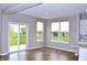 Bright living room with wood floors and sliding glass doors to the backyard at 3078 Creekridge Ct, Columbus, IN 47201
