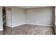 Open-concept living area with beautiful floors and a staircase at 3078 Creekridge Ct, Columbus, IN 47201