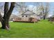 Backyard view with large deck and spacious lawn at 3414 Arbor Ave, Indianapolis, IN 46217