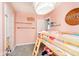 Sweet pink bedroom featuring a cozy bunk bed and decor, ideal for a space at 3414 Arbor Ave, Indianapolis, IN 46217