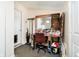 Bright bonus space featuring a makeup vanity, chair, and ample natural light from an exterior door at 3414 Arbor Ave, Indianapolis, IN 46217