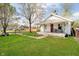 Quaint home featuring a welcoming front porch and a spacious, green front yard at 3414 Arbor Ave, Indianapolis, IN 46217