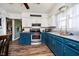 Bright kitchen with stainless steel appliances and contemporary finishes at 3414 Arbor Ave, Indianapolis, IN 46217
