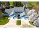 Aerial view of townhomes showcasing well-manicured lawns, mature trees, and convenient garage access at 3624 N Lakeside Dr, Muncie, IN 47304
