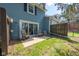 Outdoor patio with room for seating, grass, and fence at 3624 N Lakeside Dr, Muncie, IN 47304