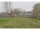 Large backyard with wooden fence at 3648 Valley Lake Dr, Indianapolis, IN 46227