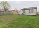 The home showcases a spacious backyard with lush green grass, ideal for outdoor activities and relaxation at 3648 Valley Lake Dr, Indianapolis, IN 46227