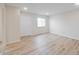 Bright bedroom featuring hardwood floors, neutral paint, and a window for natural light at 3648 Valley Lake Dr, Indianapolis, IN 46227