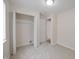 This empty bedroom has neutral walls and carpet and an open closet at 3648 Valley Lake Dr, Indianapolis, IN 46227