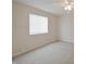 This empty bedroom has neutral walls and carpet and one window at 3648 Valley Lake Dr, Indianapolis, IN 46227