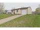 Charming single-story home featuring a well-manicured front yard and a convenient attached garage at 3648 Valley Lake Dr, Indianapolis, IN 46227