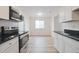 Modern kitchen featuring stainless steel appliances, stylish countertops, and an open layout at 3648 Valley Lake Dr, Indianapolis, IN 46227