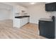This kitchen has black countertops, white cabinets, and modern, stainless steel appliances at 3648 Valley Lake Dr, Indianapolis, IN 46227