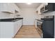 Bright kitchen with stainless steel appliances, modern cabinets, and hardwood floors at 3648 Valley Lake Dr, Indianapolis, IN 46227