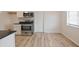 Modern kitchen featuring stainless steel appliances, stylish countertops, and hardwood floors at 3648 Valley Lake Dr, Indianapolis, IN 46227