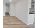 Neutral living room showcasing hardwood floors and an open layout leading into the kitchen at 3648 Valley Lake Dr, Indianapolis, IN 46227