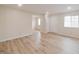 Spacious living room featuring hardwood floors, neutral paint, and an adjacent doorway at 3648 Valley Lake Dr, Indianapolis, IN 46227