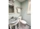 Bathroom vanity with modern sink, fixtures, and ample lighting near window at 37 N Arlington Ave, Indianapolis, IN 46219