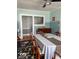 Dining room view includes a ceiling fan, buffet and portion of staircase at 37 N Arlington Ave, Indianapolis, IN 46219