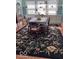The dining area has a table and chairs on a dark, patterned rug at 37 N Arlington Ave, Indianapolis, IN 46219