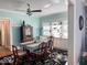 Dining room features a ceiling fan, floral rug and built in shelving at 37 N Arlington Ave, Indianapolis, IN 46219