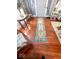 Warm entryway with hardwood floors and a decorative area rug at 37 N Arlington Ave, Indianapolis, IN 46219