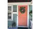 Close-up of the front door showcasing its unique color and wreath at 37 N Arlington Ave, Indianapolis, IN 46219