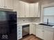 Modern kitchen featuring stainless steel appliances and white cabinetry at 37 N Arlington Ave, Indianapolis, IN 46219