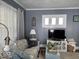 Comfortable living room featuring a sofa, TV, and tasteful decor at 37 N Arlington Ave, Indianapolis, IN 46219