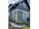Exterior of home with latticed doorway, small deck and landscaping at 37 N Arlington Ave, Indianapolis, IN 46219