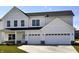 Modern two-story home featuring a two-car garage, white siding, and black trim at 3767 Thomas Jefferson Ct, Westfield, IN 46074