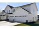 Modern two-story home featuring a two-car garage, white siding, and black trim at 3767 Thomas Jefferson Ct, Westfield, IN 46074