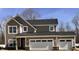 Craftsman-style home with a two-car garage, stone accents, shake siding, and horizontal siding at 3818 Thomas Jefferson Ct, Westfield, IN 46074