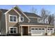 Craftsman-style home with a two-car garage, stone accents, shake siding, and horizontal siding at 3818 Thomas Jefferson Ct, Westfield, IN 46074