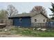 This property features a garage with blue and tan siding, along with an above ground pool at 389 W Poston Rd, Martinsville, IN 46151