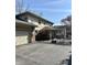 View of the backyard and patio featuring a fenced-in yard and attached garage with a brick and siding exterior at 3911 E 75Th St, Indianapolis, IN 46240