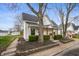 Attractive single-Gathering home showcasing its well-maintained yard and classic architectural details at 419 S Oak St, Fortville, IN 46040