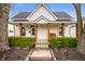 Charming home featuring a cozy front porch with a swing and beautiful landscaping at 419 S Oak St, Fortville, IN 46040